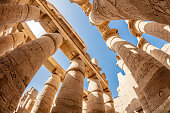 The sun's rays penetrate the columns in the Karnak temple.