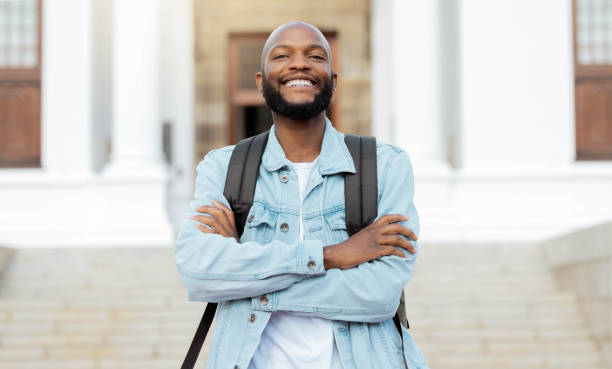 istock Portrait, education and proud man, university and student at campus for learning, future and goals. Face, learner and college, scholarship and young guy smile, study and knowledge, academic and goals 1480285922