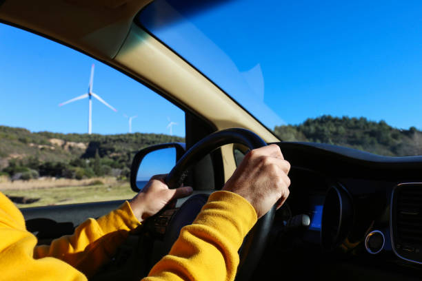 istock Wind farm turbines view from the car. 1480286218