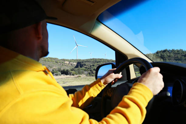 istock Wind farm turbines view from the car. 1480286763