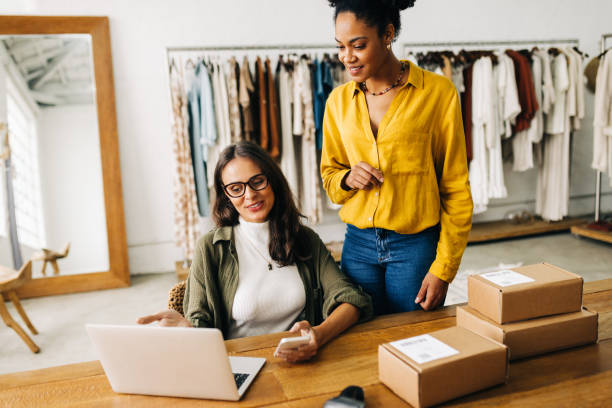 istock Business women using a laptop to review orders on their ecommerce website 1480291994