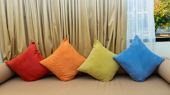 The many colorful of cushion comfortable sofa in modern apartment