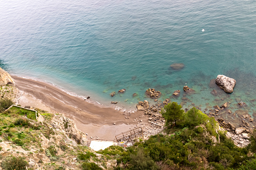 Empty beautiful beach on the Amalfi Coast, Campania, Italy, Europe. Summer holiday and vacation concept. Inspirational tropical paradise beach. Province of Salerno. Turquoise colored water. Hidden Gem