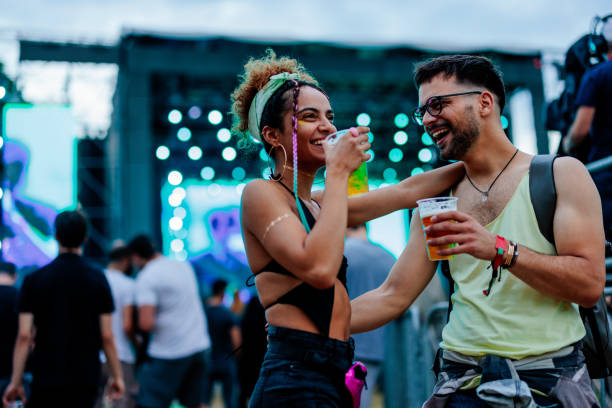 istock Couple drinking beer at concert 1480294466