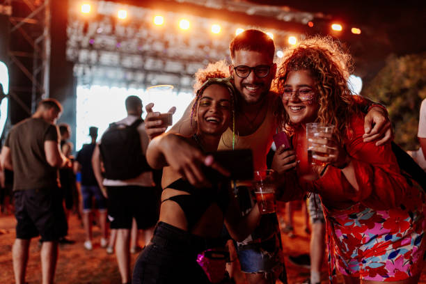 istock Enthusiastic friends taking selfie at concert 1480294684
