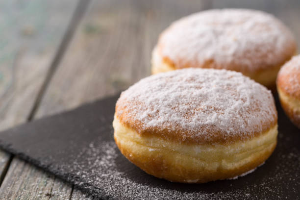 istock Ruddy delicious donuts berliners on a stone board 1480300644