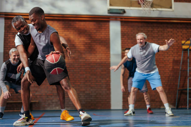 istock Cheerful people play basketball. 1480302430