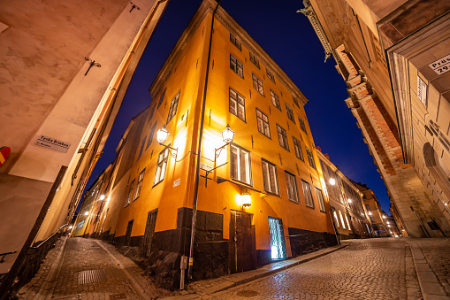 Streets of Gamla Stan Old Town of Stockholm famous city architecture early morning twilight sky street lights Capital of Sweden Scandinavia Northern Europe