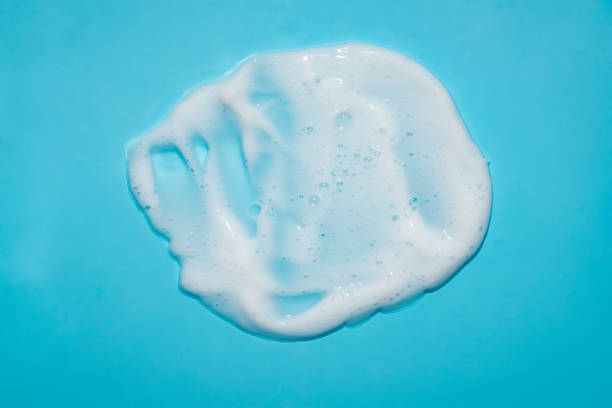 istock White lather foam moisturizer cleanser on blue 1480307028