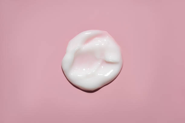 istock white cream swatch on pink background 1480307032