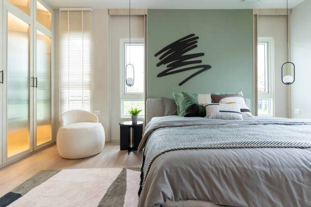 istock Modern bedroom interior with green wall and wall art. 1480307162