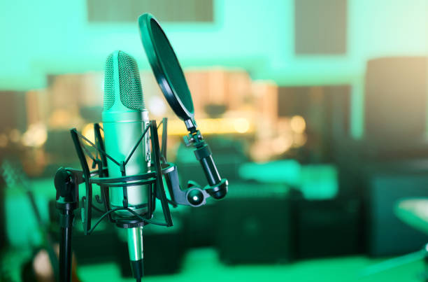 istock Music, audio and microphone for a singer, musician or artist in a studio for a performance. Podcast, radio and equipment for sound production, singing and musical entertainment in an empty room 1480307938