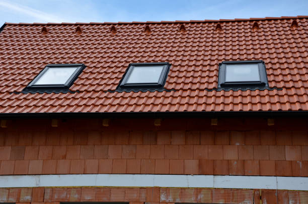 istock construction work on a house made of modern insulating bricks. roof windows, new housing. Windows openings, price of masonry. weekly companies, quality of work, companies 1480309508