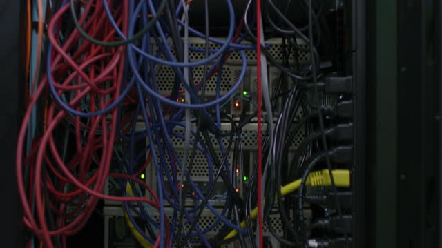 Wires, technology and a server room for internet, network and connection. Communication, data and a system of connected cables in a processor for tech, computing equipment and router in the dark