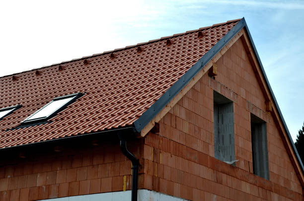 istock construction work on a house made of modern insulating bricks. roof windows, new housing. Windows openings, price of masonry. weekly companies, quality of work, companies 1480313113