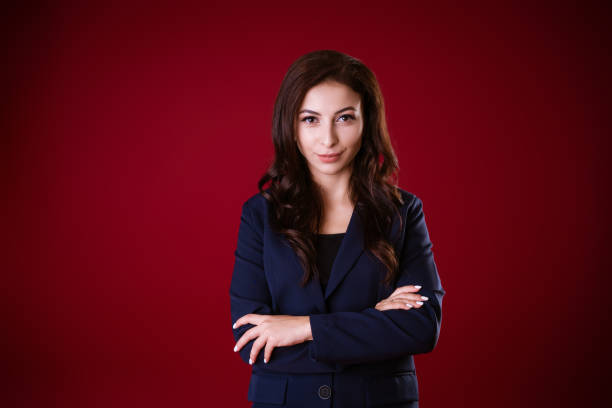 istock Business woman posing over red background 1480313430