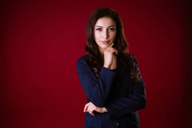 istock Business woman posing over red background 1480313432