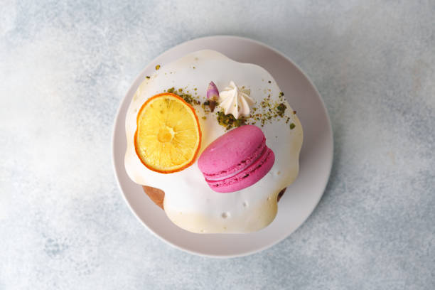 Beautiful Easter cake decorated with macarons cookie and dry orange piece