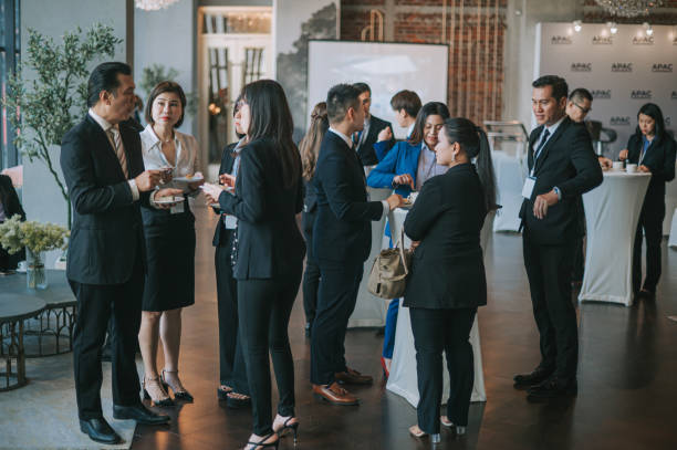 asian multiethnic business people talk during a coffee break in seminar business conference - event convention center business hotel imagens e fotografias de stock