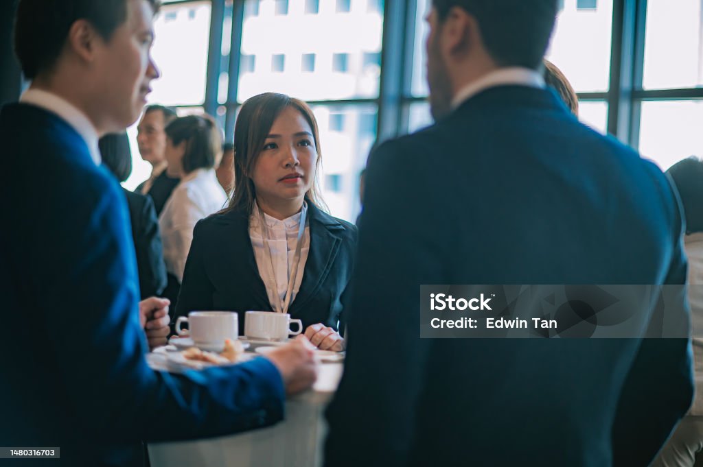 Asian Multiethnic business people talk during a coffee break in Seminar Business conference Listening Stock Photo