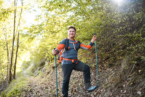 Front View Of Cheerful Senior Hiker In Forest