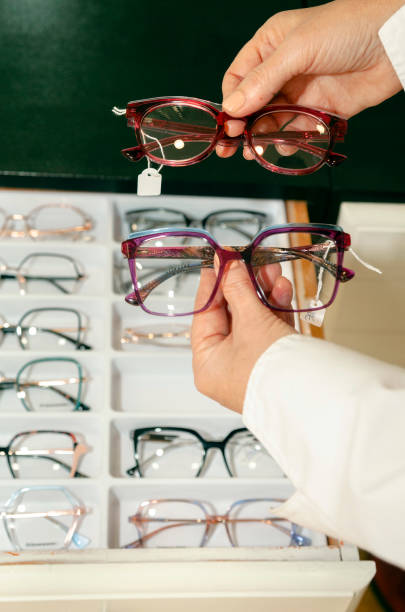 istock Female optometrist hands holding glasses 1480317435