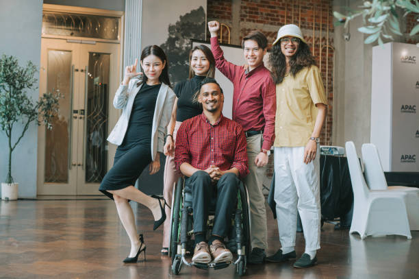 istock group photo of Asian seminar workshop participants looking at camera smiling 1480318325