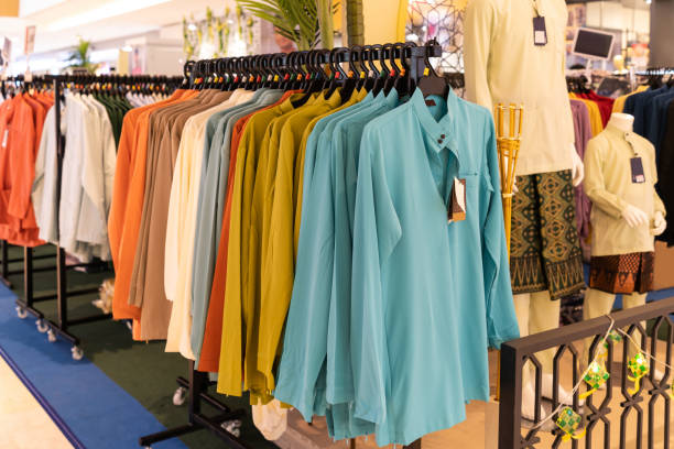 Close-up view of Baju Melayu on hangers for sale. stock photo