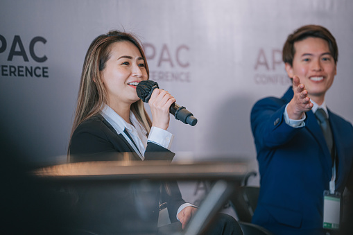 Young performer singing at a concert