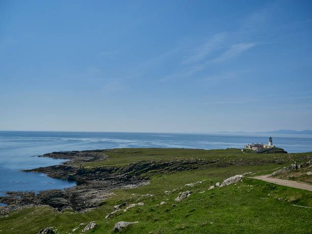 istock Neist Point Lighthouse is sitting high on cliff. 1480320914