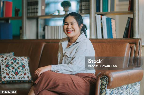 Indoor Portrait Asian Chinese Young Woman Looking At Camera Smiling Stock Photo - Download Image Now