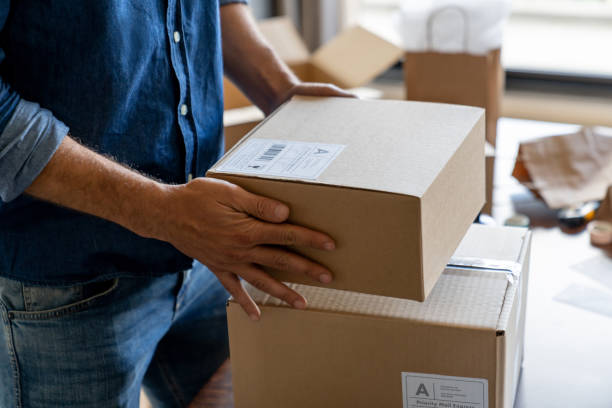 istock Entrepreneur shipping orders while running his e-commerce business from home 1480323468