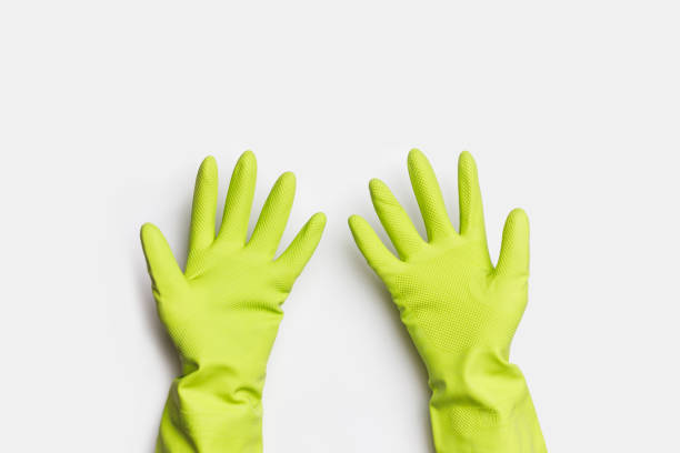 istock Hands in Green Rubber Gloves on white background 1480325004