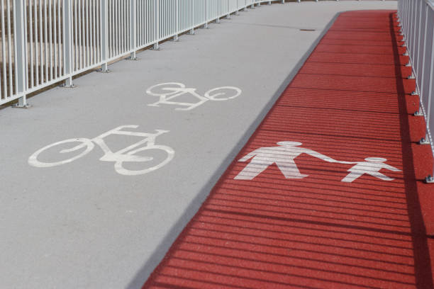 Road markings for cyclists on orange background and white circle