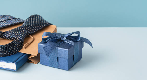 istock Happy Fathers Day background. gift box, necktie,on blue table. 1480327485