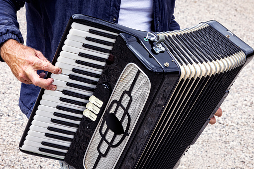 Accordion isolated in white. Accordion in closeup key while waiting for the interpreter