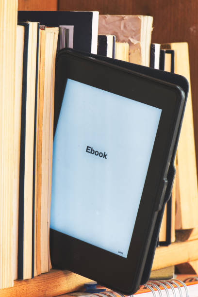 istock Detail of an e book reader among classic books 1480329775