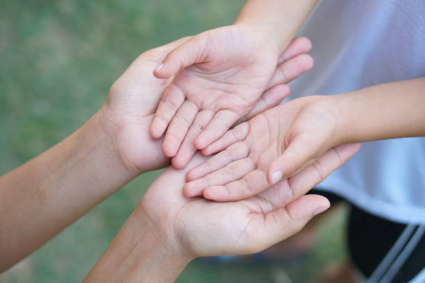 istock Mother holding son's hand to encourage and warm 1480329869
