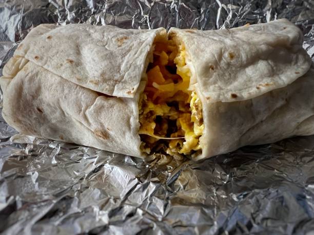 istock Taco Vender Breakfast Burrito w chorizo-bacon-cheese-chiles-and spicy salsa 1480331261