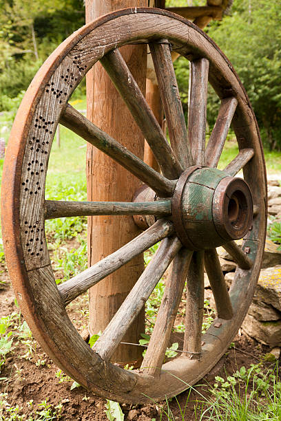 istock Old wooden wagon wheel 148033352