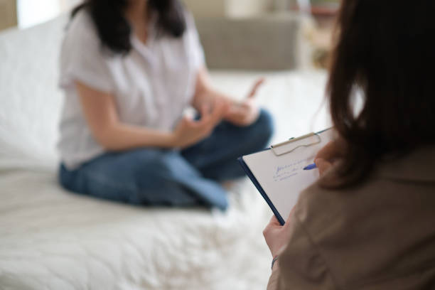 istock patient makes progress towards healing and recovery as she talks with her therapist about her struggles. psychologist takes notes during the therapy session to help her patient 1480337052