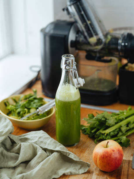 istock Green freshly pressed juice and electric slow juicer 1480337160