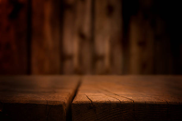 istock Empty wooden surface with defocused wooden wall in the background. 1480338030