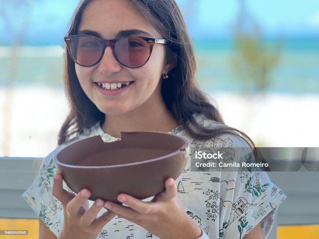 Crazy for chocolate Girl eating chocolate 12-13 Years Stock Photo