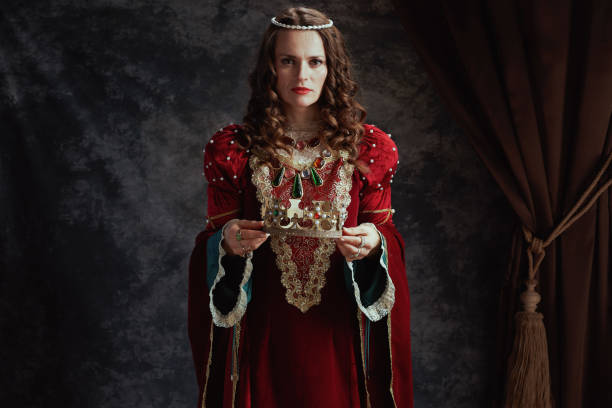 istock medieval queen in red dress with crown 1480343033
