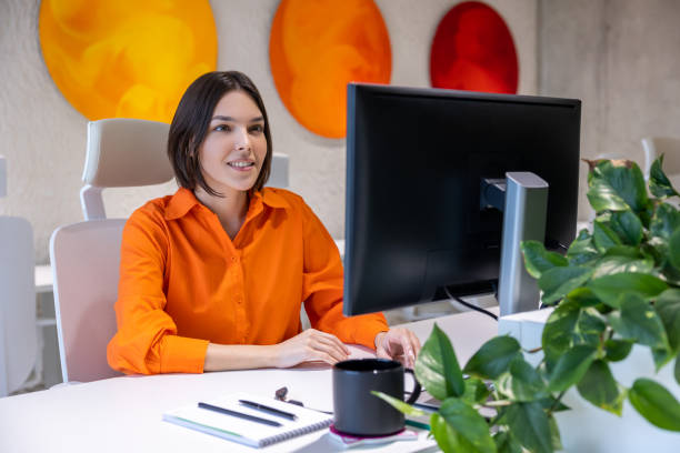istock Focused employee working on the desktop PC in the office 1480345096