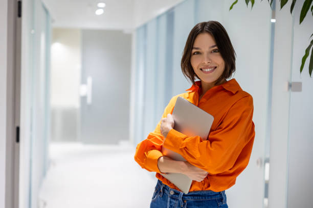 istock Joyous female with the computer posing for the camera indoors 1480345241