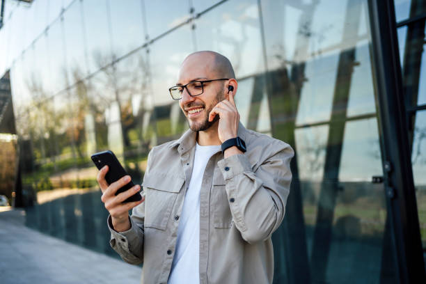 Man using mobile phone in the city stock photo