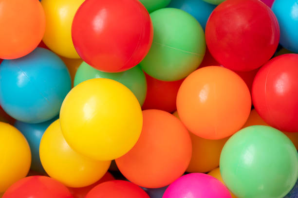 istock Colorful child balls. Multi-colored plastic balls on playground. 1480348680