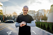 Young man using a fitness tracker